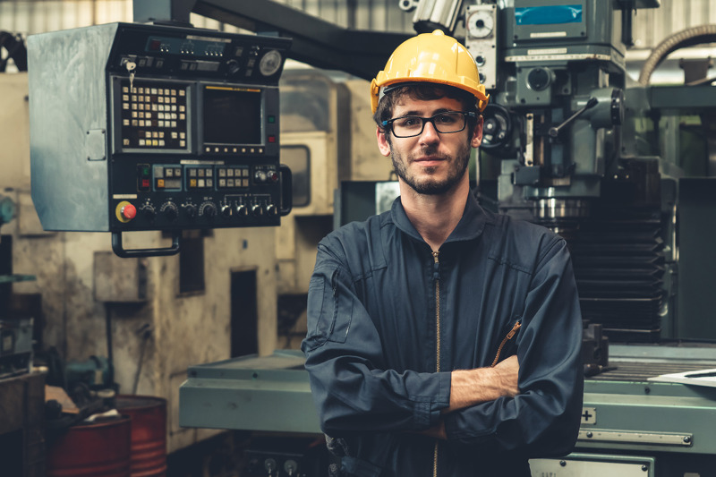 Worker at manufacturing company checking the system